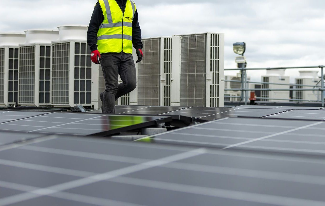 a man standing on top of a roof